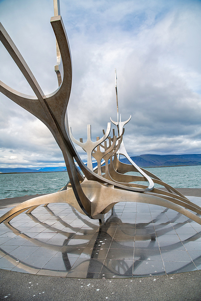 Sun Voyager monument with clouds, landmark of Reykjavik city.