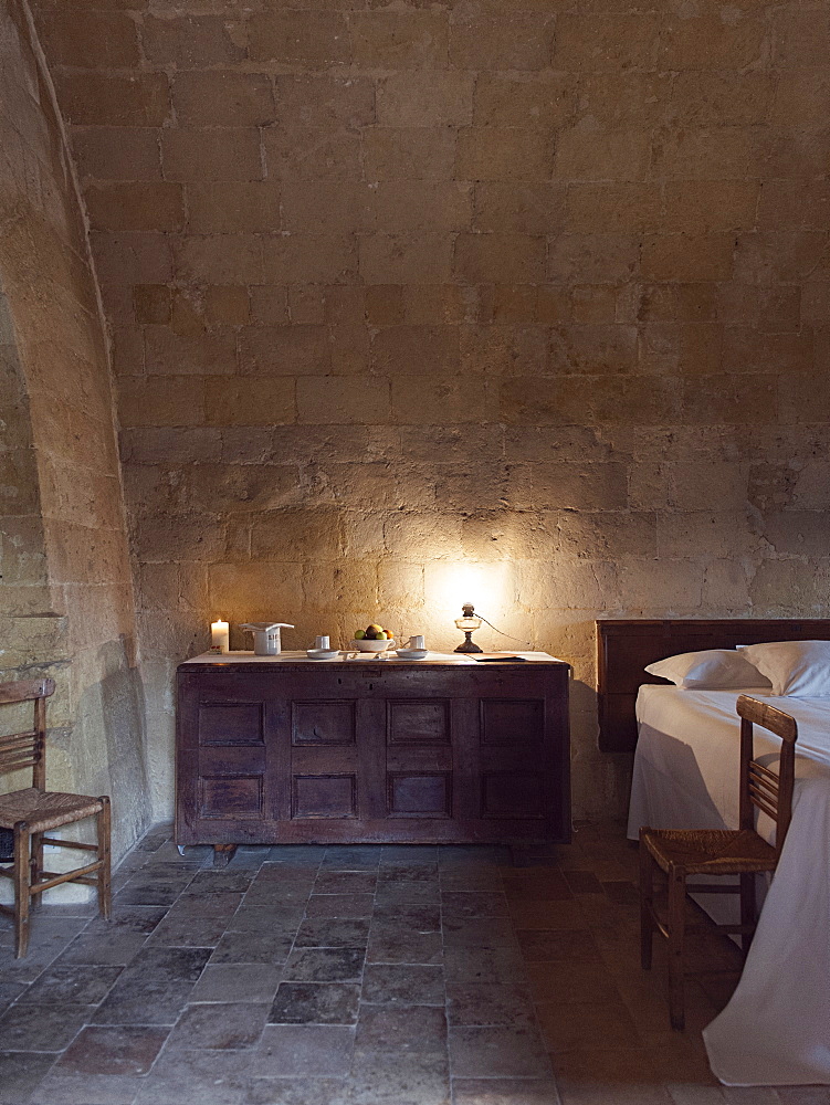 Bedroom of the hotel Le Grotte della Civita located in the Sassi di Matera that represents the almost paradigmatic expression of the Minor Historical Heritage, Matera, Basilicata, Italy, Europe