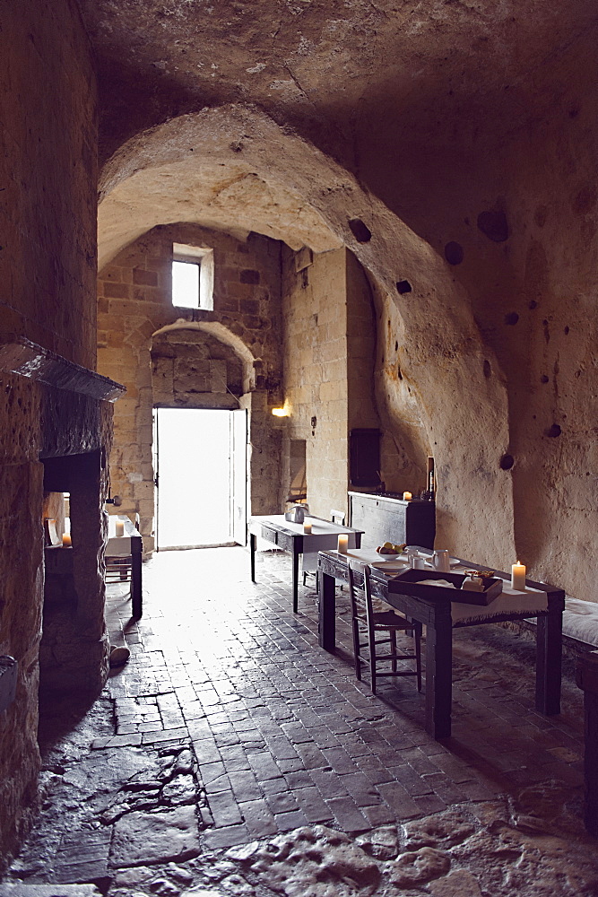 Dining rooms of the hotel Le Grotte della Civita, It is a hotel housed in ancient cave houses by the projects of "Sextantio", Matera, Basilicata, Italy, Europe