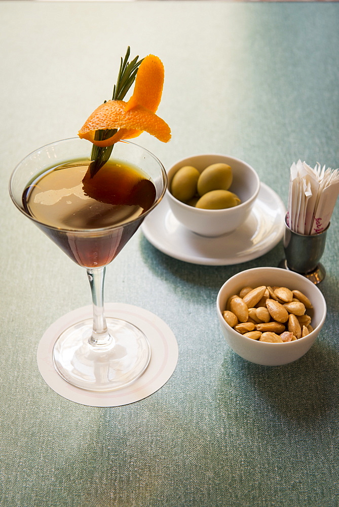 Still life of Zazou cocktail with olives and almonds at Bar Luce, Fondazione Prada, Milano, Lombardy, Italy, Europe