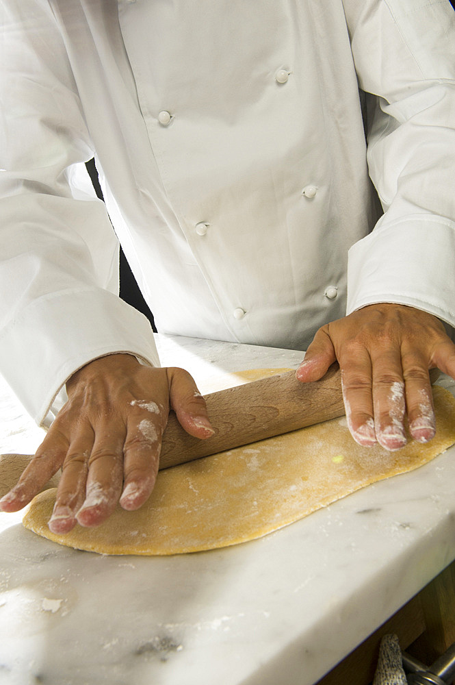 Working with fresh handmade pasta Pansoti, typical of Liguria. Italy