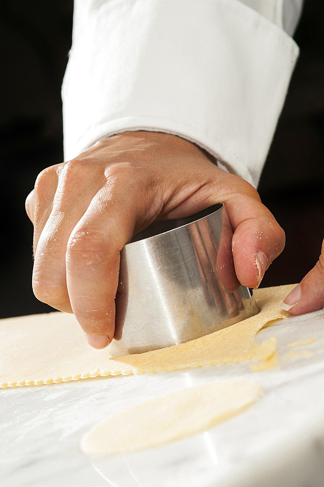 Making fresh tortelli by hand. Italy