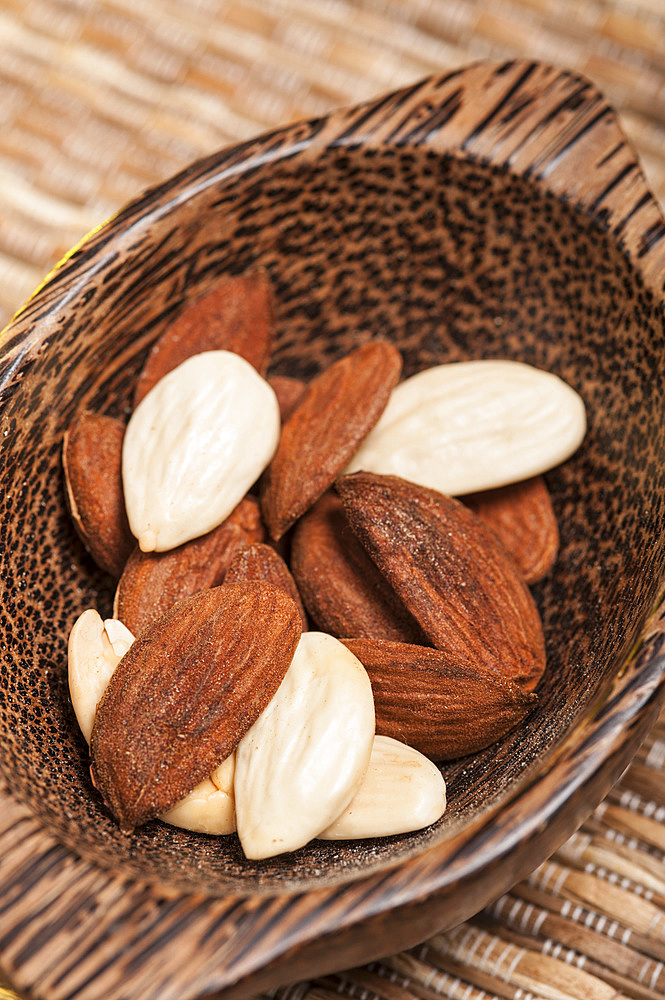 Almonds in a wooden bowl.