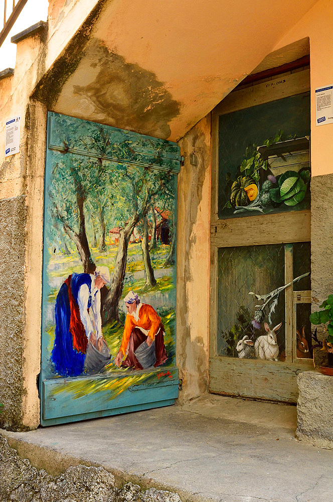 The painted doors of the village of Valloria have made it famous. Imperia; Liguria, Italy