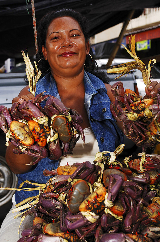 Seller of Pacific Ocean crabs at the Zacatecoluca market. El Salvador, Central America.