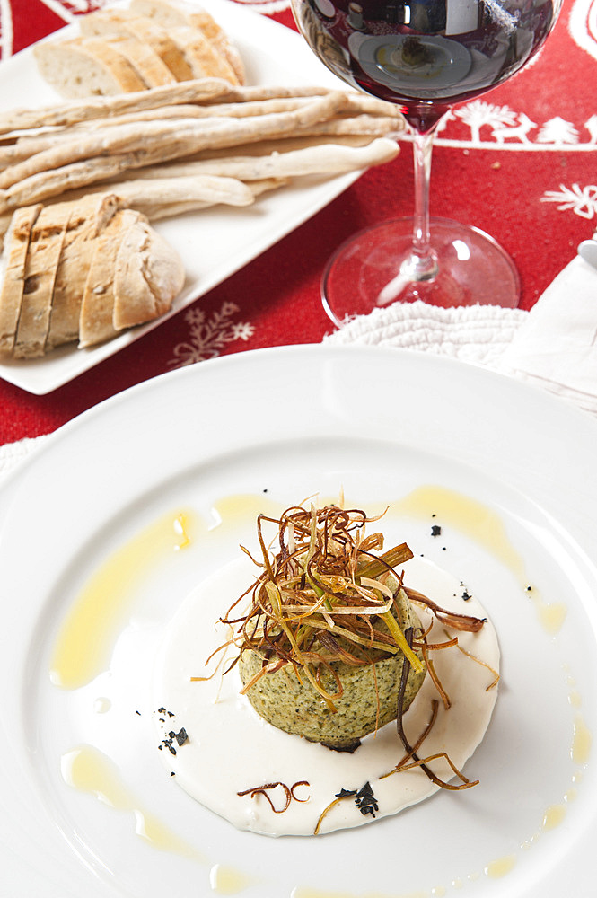 Broccoli flan with goat cream and crispy leek cloud at La Clotze Restaurant in Planpincieux in Val Ferret, Courmayeur, Val d'Aosta, Italy