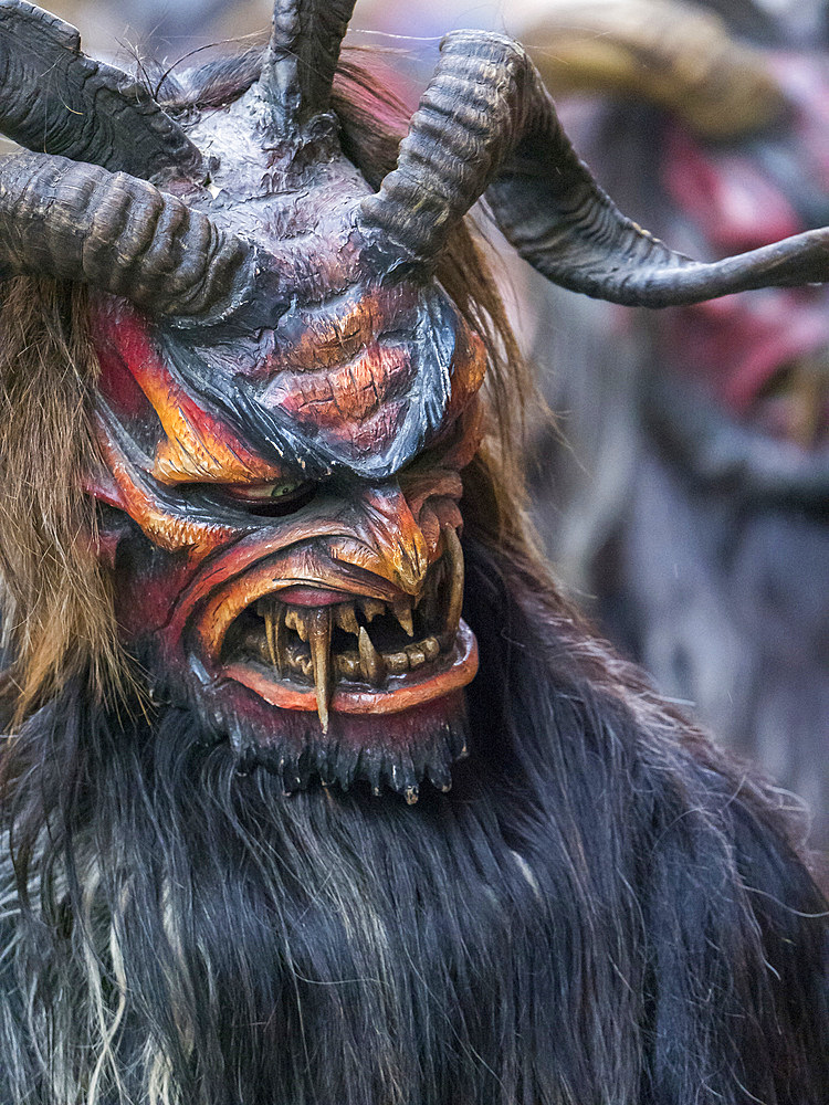 Krampuslauf or Perchtenlauf during advent in Munich, an old alpine tradition taking place during christmas time in Bavaria, Austria and South Tyrol. Europe, Central Europe, Germany, Bavaria, December