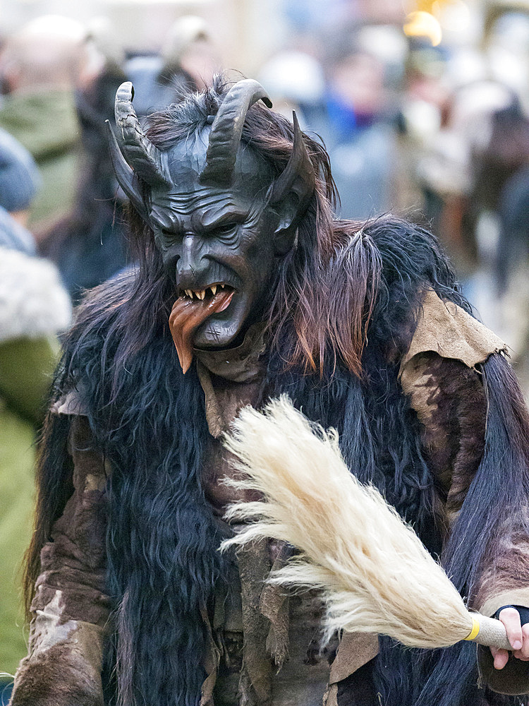 Krampuslauf or Perchtenlauf during advent in Munich, an old alpine tradition taking place during christmas time in Bavaria, Austria and South Tyrol. Europe, Central Europe, Germany, Bavaria, December