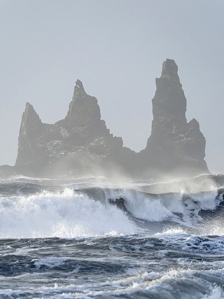 The coast of the north atlantic near Vik y Myrdal during winter.The sea stacks Reynisdrangar. Europe, Northern Europe, Scandinavia, Iceland, February