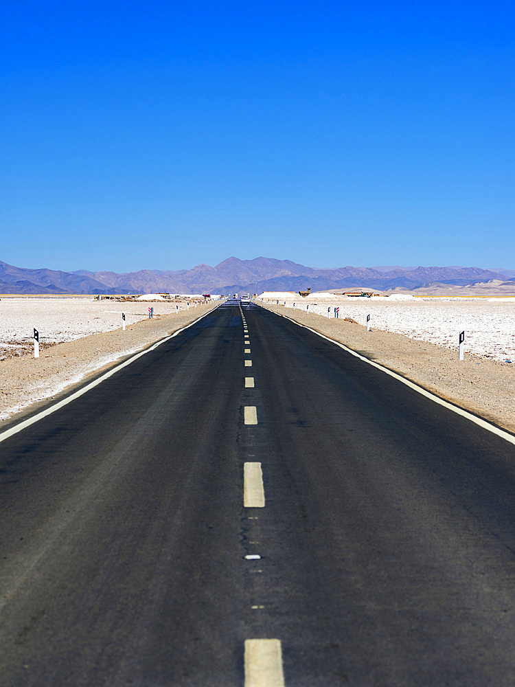 Routa 52 is crossing the Salar towards Chile. Landscape on the salt flats Salar Salinas Grandes in the Altiplano. South America, Argentina