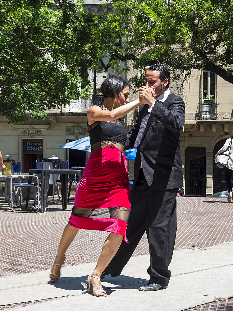 Plaza Dorrego in quarter San Telmo. Professional tago dancers performing for guests of a cafe. Buenos Aires, the capital of Argentina. South America, Argentina, November