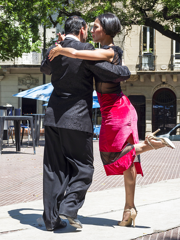 Plaza Dorrego in quarter San Telmo. Professional tago dancers performing for guests of a cafe. Buenos Aires, the capital of Argentina. South America, Argentina, November