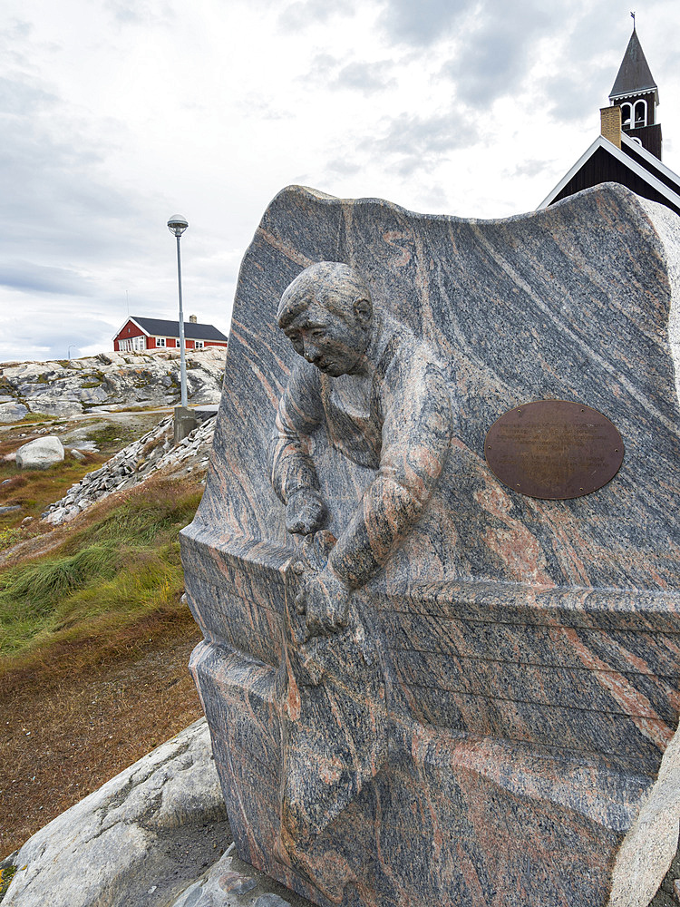 Monument commemorating long line fishing and hallibut. Town Ilulissat at the shore of Disko Bay in West Greenland, center for tourism, administration and economy. The icefjord nearby is listed as UNESCO world heritage. America, North America, Greenland, Denmark