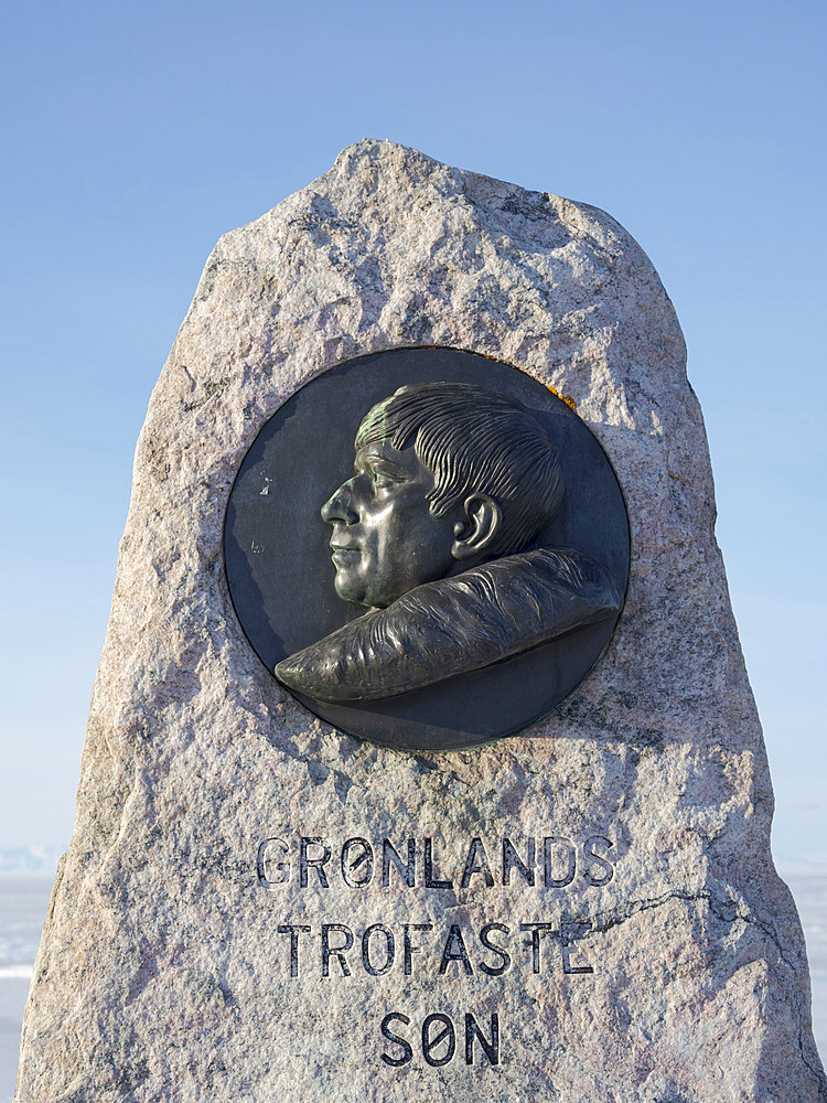 Monument for Knud Rasmmusen. Winter in Ilulissat on the shore of Disko Bay. America, North America, Greenland, Denmark