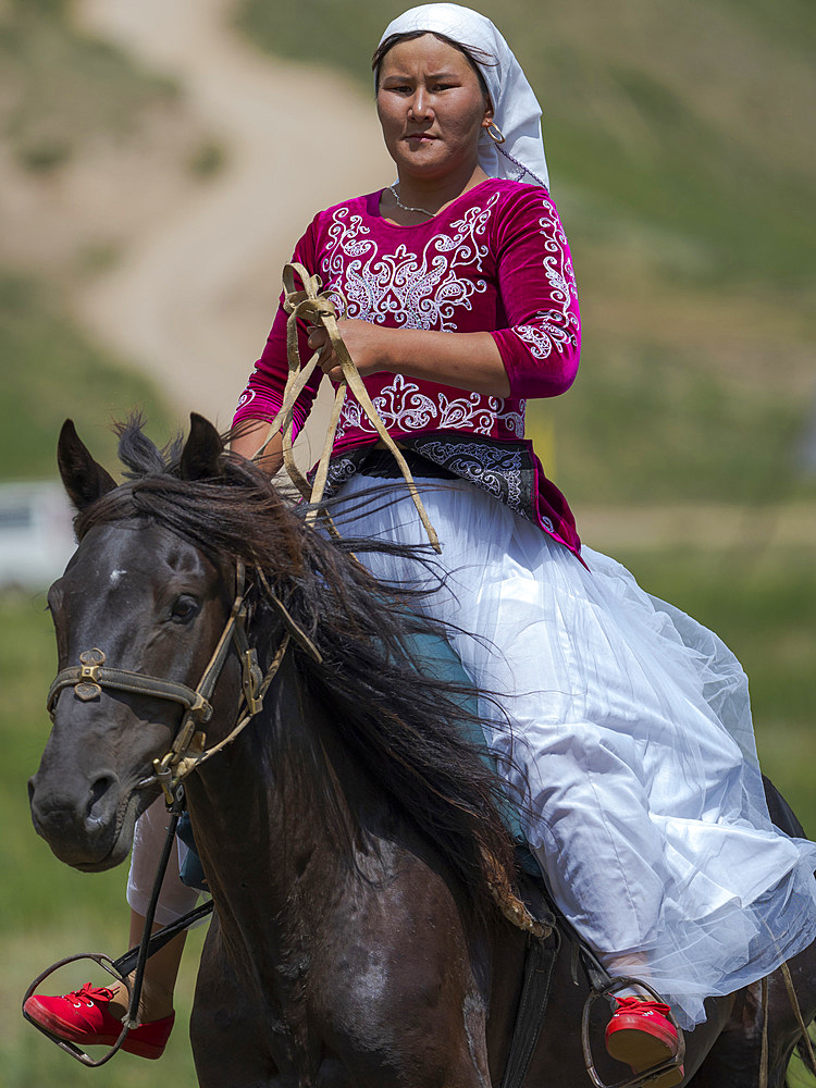 Kyz kuumai, bridegroom chasing the bride, a traditional equestrian sport. Folk Festival commemorating the origin myth the Tien Shan Maral (Tian Shan wapiti), an origin myth of the Kyrgyz tribes. Near Tasch Baschat, Naryn region. Asia, Central Aisa, Kyrgyzstan