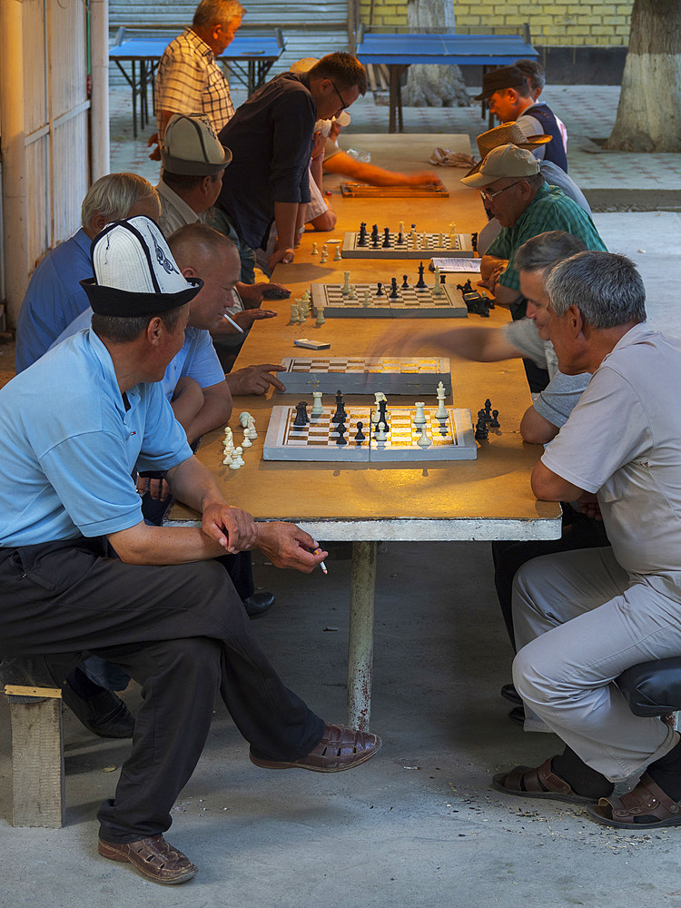 Chess player in Navoi Park. City Osh in the Fergana Valley close to the border to Uzbekistan. Asia, central Asia, Kyrgyzstan