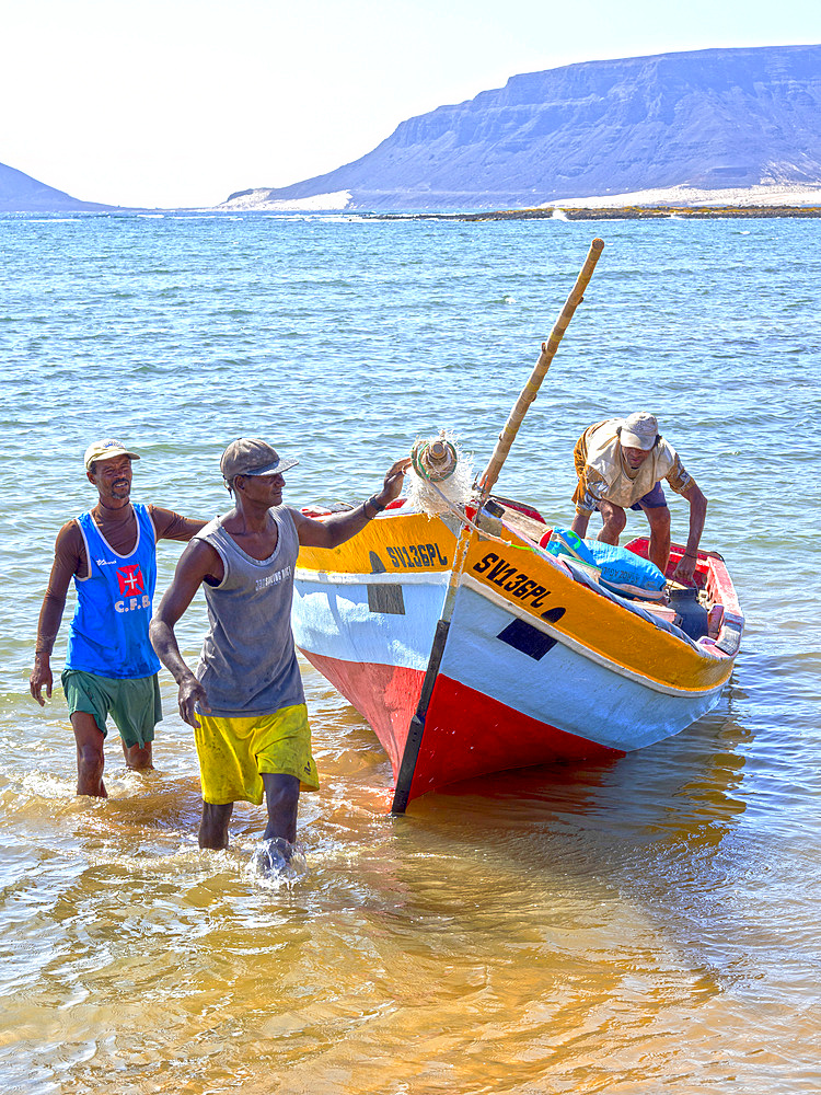 Fishermen getting ready to go fishing with traditional fishing boats near Baia das Gatas. Island Sao Vicente, Cape Verde an archipelago in the equatorial, central Atlantic in Africa.