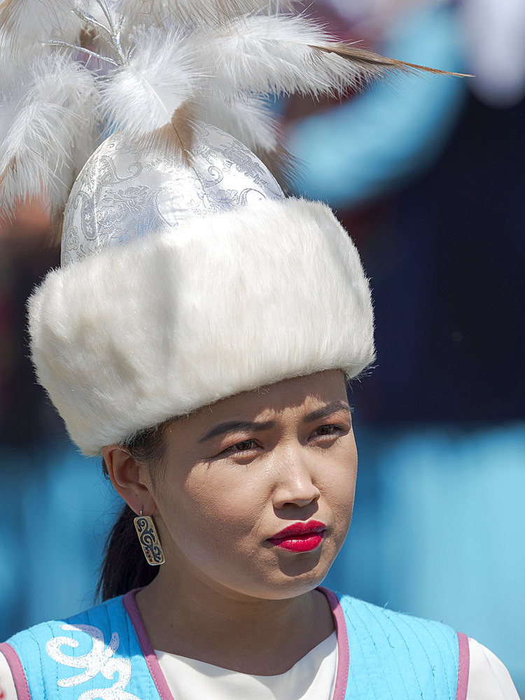 Musician in traditional garment. Folk and Sport festival on the Suusamyr plain commemorating Mr Koshomkul, a sportsman and folk hero of the last century. Asia, central asia, Kyrgyzstan