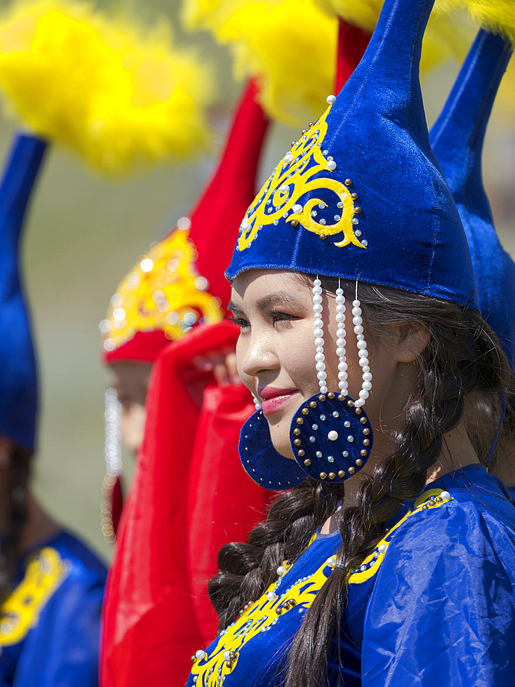 Girls of folk music band posing for visitors and photographers. Folk and Sport festival on the Suusamyr plain commemorating Mr Koshomkul, a sportsman and folk hero of the last century. Asia, central asia, Kyrgyzstan