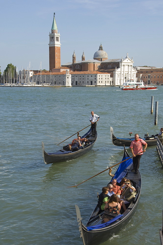 Gondolas with the island church of San Giorgio Maggiore, Venice, UNESCO World Heritage Site, Veneto, Italy, Europe