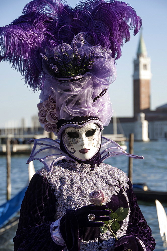 Lady in black and purple mask and feathered hat, Venice Carnival, Venice, UNESCO World Heritage Site, Veneto, Italy, Europe