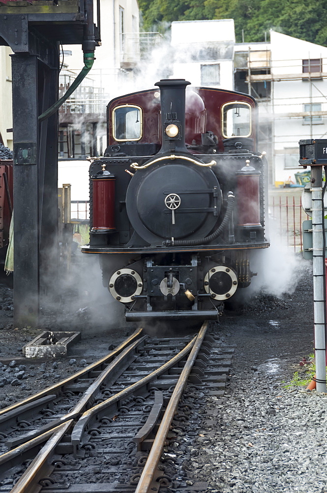 Narrow gauge Blaenau Ffestiniog railway station engine taking water and coal, Porthmadog, Llyn Peninsular, Gwynedd, Wales, United Kingdom, Europe