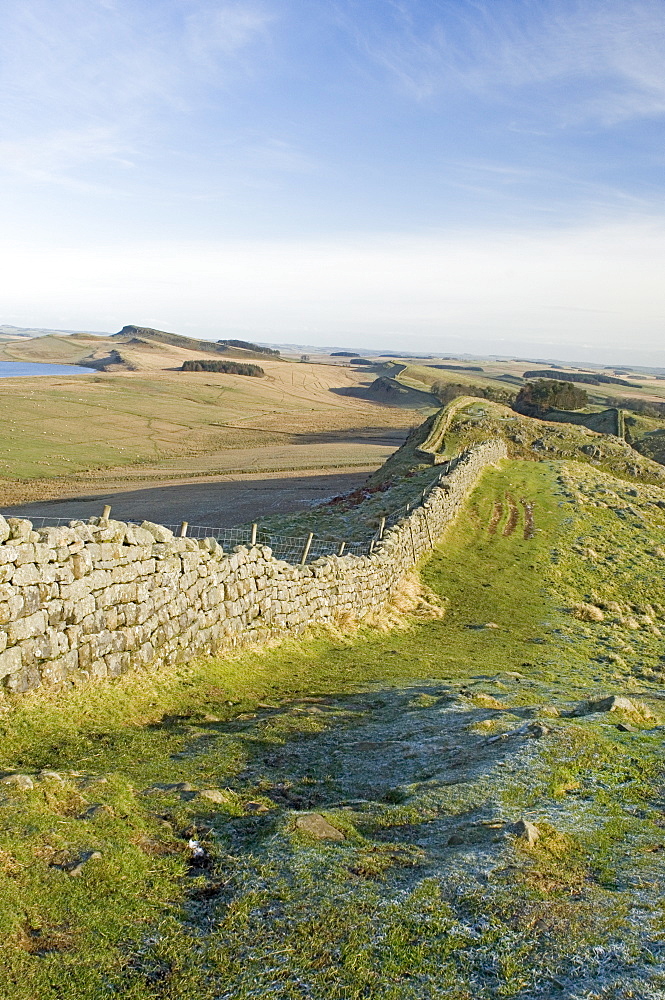 Looking east at Holbank Crags showing course of wall to Sewingshields Crag and Broomlee Lough, Roman Wall, UNESCO World Heritage Site, Northumbria, England, United Kingdom, Europe