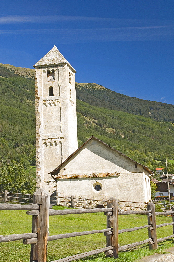 The 8th century S. Benedetto church which houses a famous fresco, in the village of Malles Venosta, below Reschen Pass, Western Dolomites, Italy, Europe