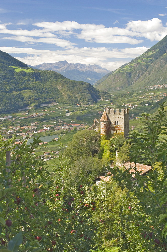 View from Dorf Tyrol of the 13th century Brunnenburg Castle, once the home of Ezra Pound and now a museum, and the valley towards the Reschen Pass and Austria, Merano, Western Dolomites, Italy, Europe