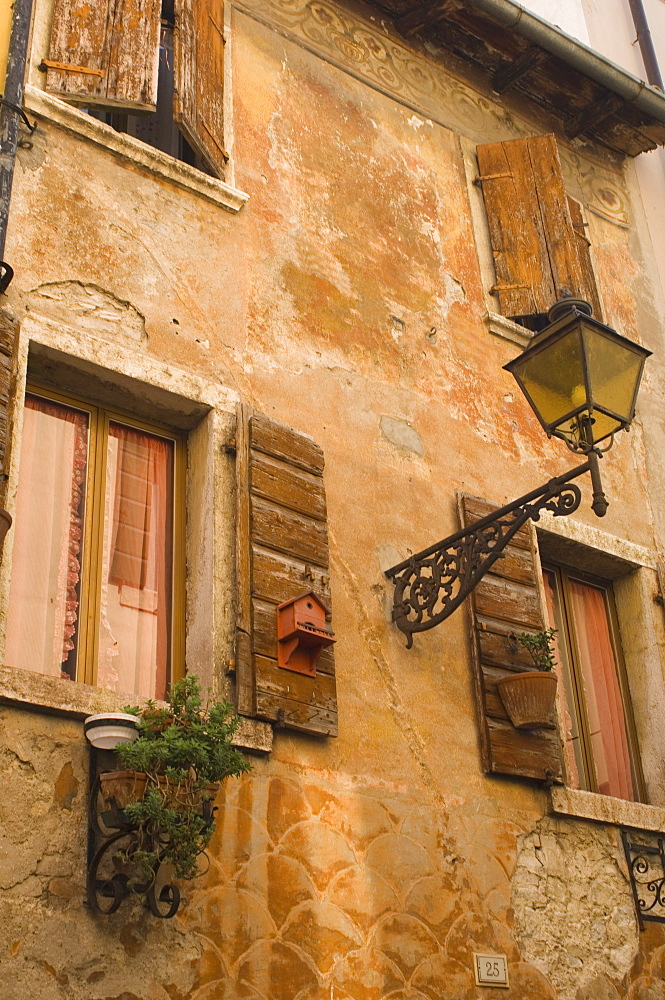 Old wall with shuttered windows, Lazise, Lake Garda, Veneto, Italy, Europe