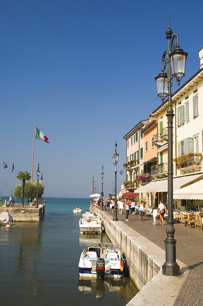 Harbour entrance and quayside cafes, Lazise, Lake Garda, Veneto, Italy, Europe