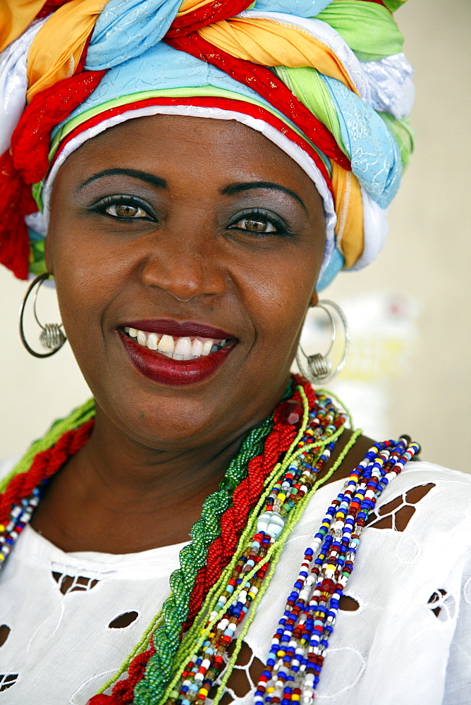 Portrait of a Bahian woman in traditional dress at the Pelourinho district, Salvador, Bahia, Brazil, South America