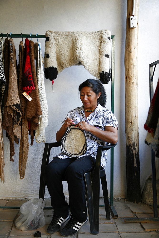 Quechua woman weaving at the market of Cafayate, Salta Province, Argentina, South America