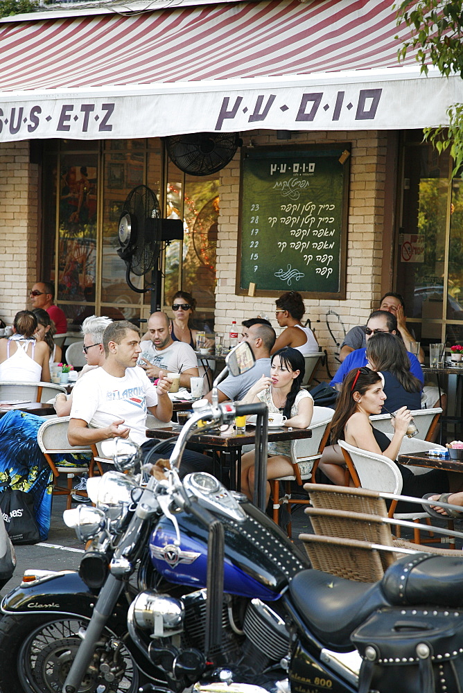 Young people sitting at Sus Etz Cafe in the trendy Sheinkin street, Tel Aviv, Israel, Middle East