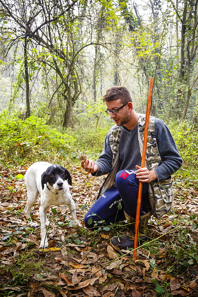 Truffle hunter with his dog, Langhe, Cueno, Piedmont, Italy, Europe