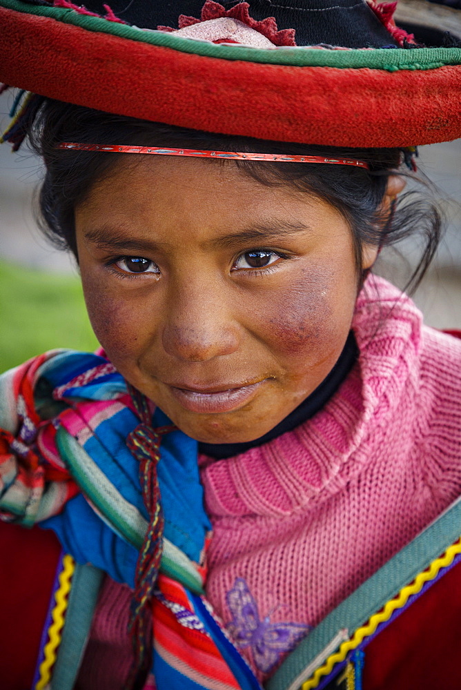 Portrait of a Quechua girl with traditional dress, Cuzco, Peru, South America