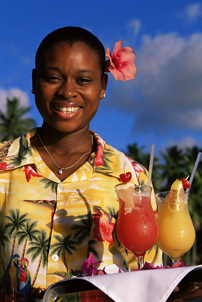 Waitress holding a tray of punch drinks, Marigot Bay, St. Lucia, Windward Islands, West Indies, Caribbean, Central America