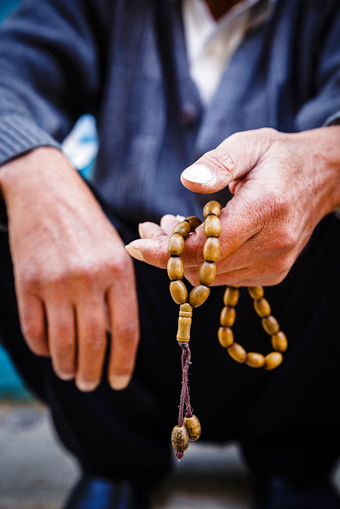 Hands holding worry beads, Bethlehem, West Bank, Palestine territories, Israel, Middle East