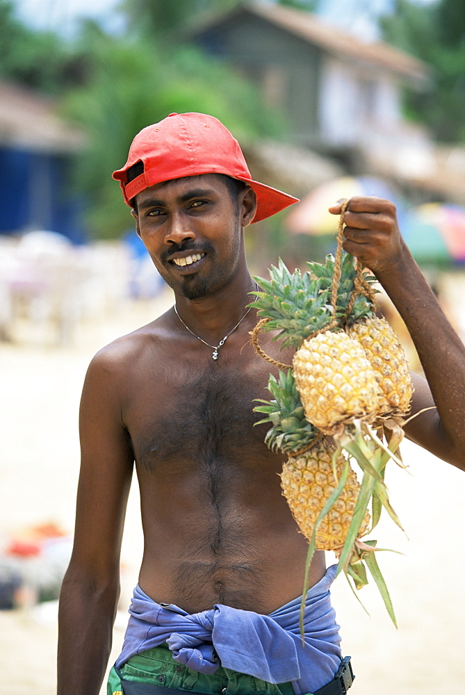 Pineapple seller on the beach, Hikkaduwa, Sri Lanka, Asia