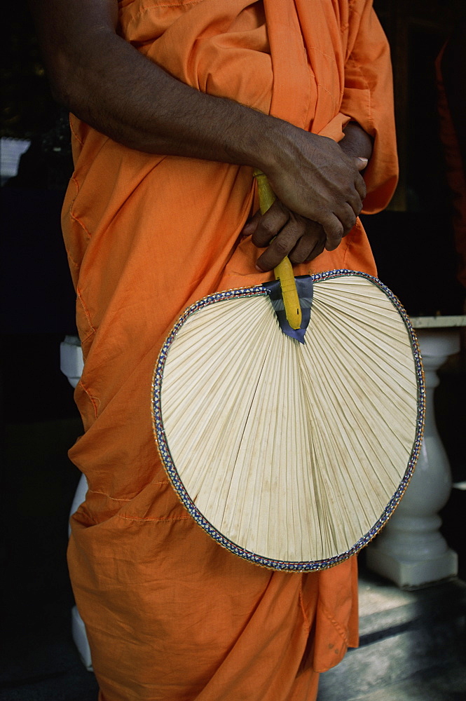 Buddhist monk with fan, Sri Lanka, Asia