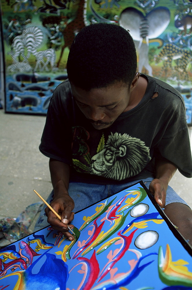 Zanzibari artist painting Tingatinga painting, Stone Town, Zanzibar, Tanzania, East Africa, Africa