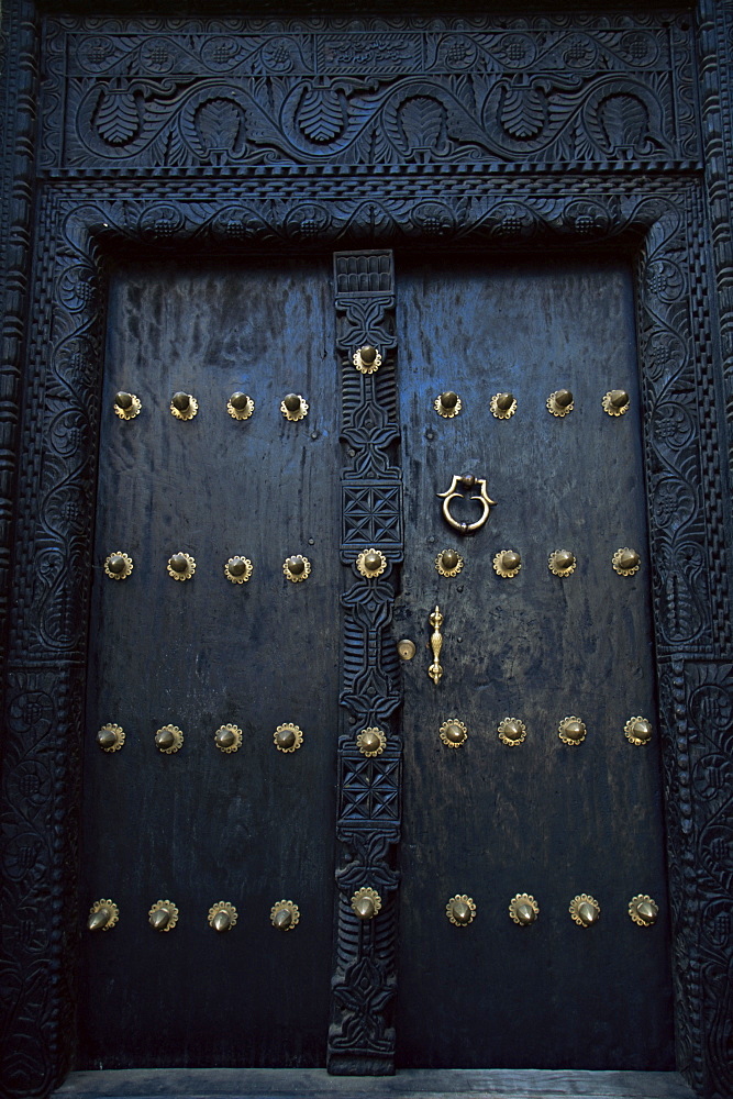 Traditional carved wooden door in Stone Town, Zanzibar, Tanzania, East Africa, Africa