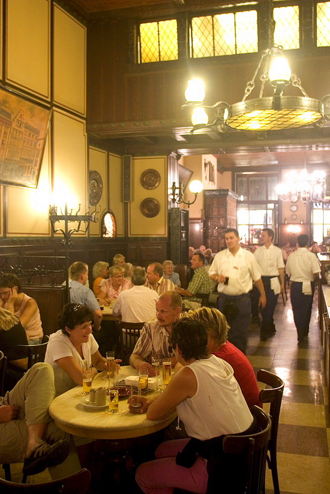 People sitting inside the Fruh am Dom beer hall in the Altstadt (Old Town), Cologne, North Rhine Westphalia, Germany, Europe