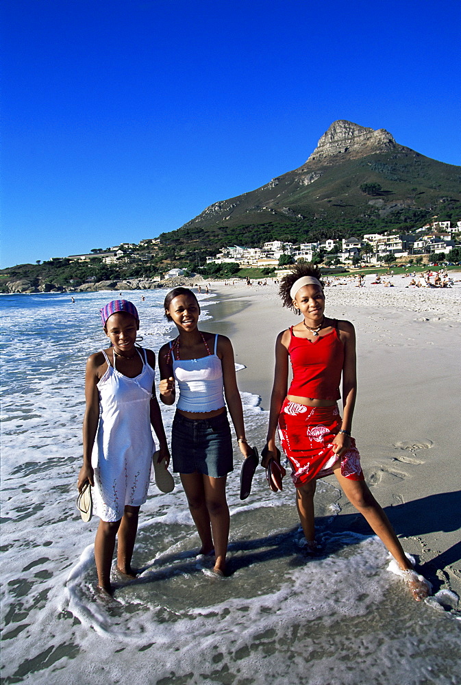 Young women on Camps Bay beach, Cape Town, South Africa, Africa