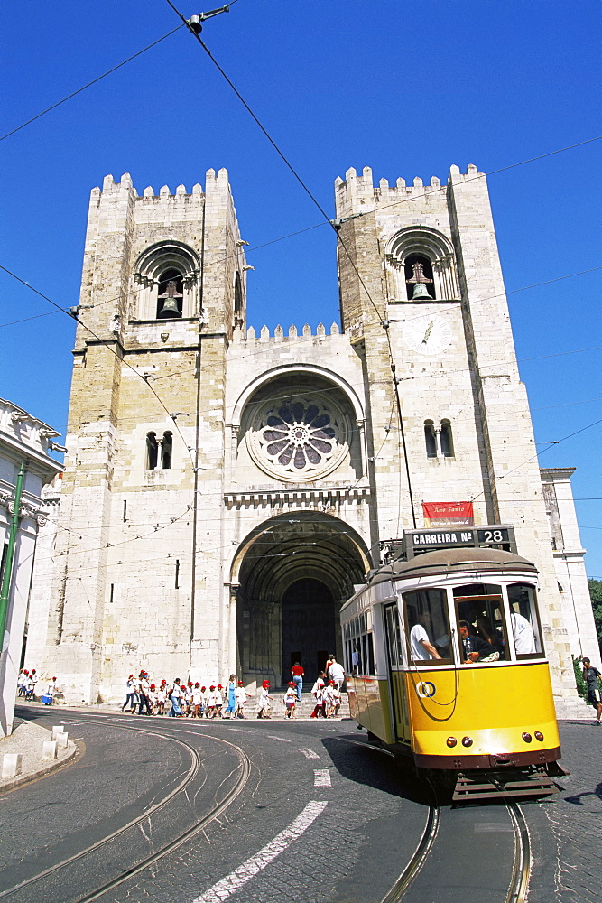 Electrico (electric tram) in front of the Se Cathedral, Lisbon, Portugal, Europe