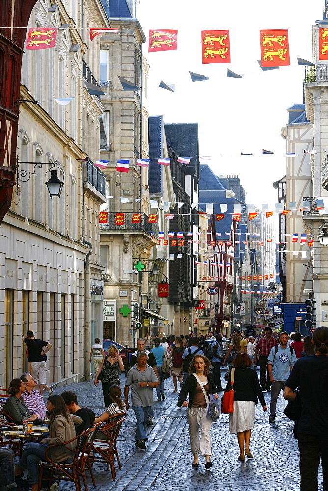 People walking along the Rue du Gros Horloge, the main street of old Rouen, Normandy, France, Europe