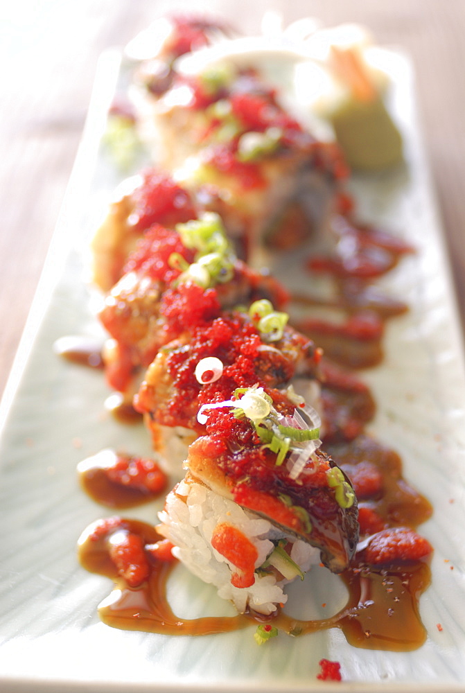 Plate of sushi rolls with hot sauce, Japan, Asia