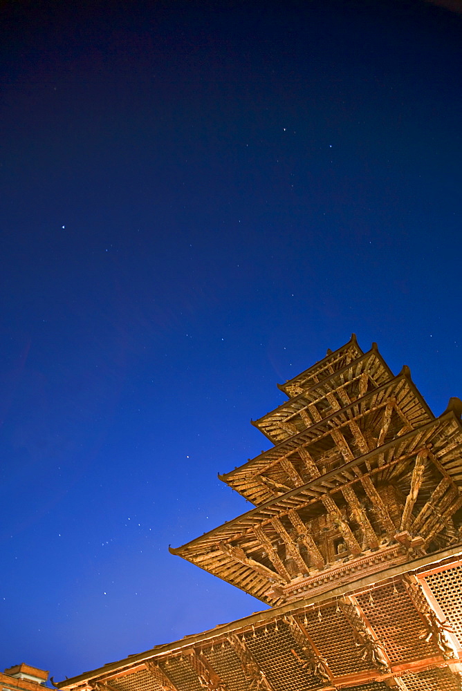 The constellation of Orion, in sky at bottom right and the five tiered pagoda roof of the Kumbeshwar temple, dating from 1392, one of two five tiered temples in the valley. Patan, Kathmandu Valley, UNESCO World Heritage Site, Nepal, Asia