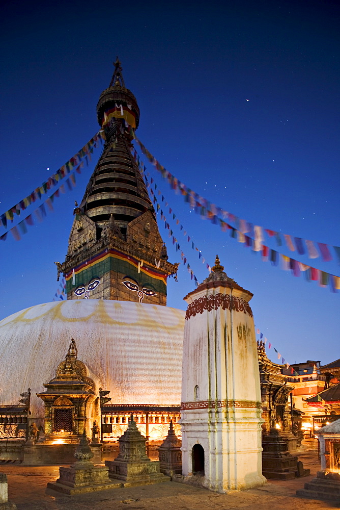 Swayambhunath (Swayambhu) (Monkey Temple) Buddhist stupa on a hill overlooking Kathmandu, taken at dawn with Orion in the sky behind the prayer flags, Kathmandu, UNESCO World Heritage Site, Nepal, Asia