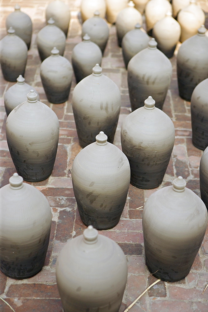 Clay pots, recently thrown, drying in the sun in Potters square, Bhaktapur, Kathmandu valley, Nepal, Asia